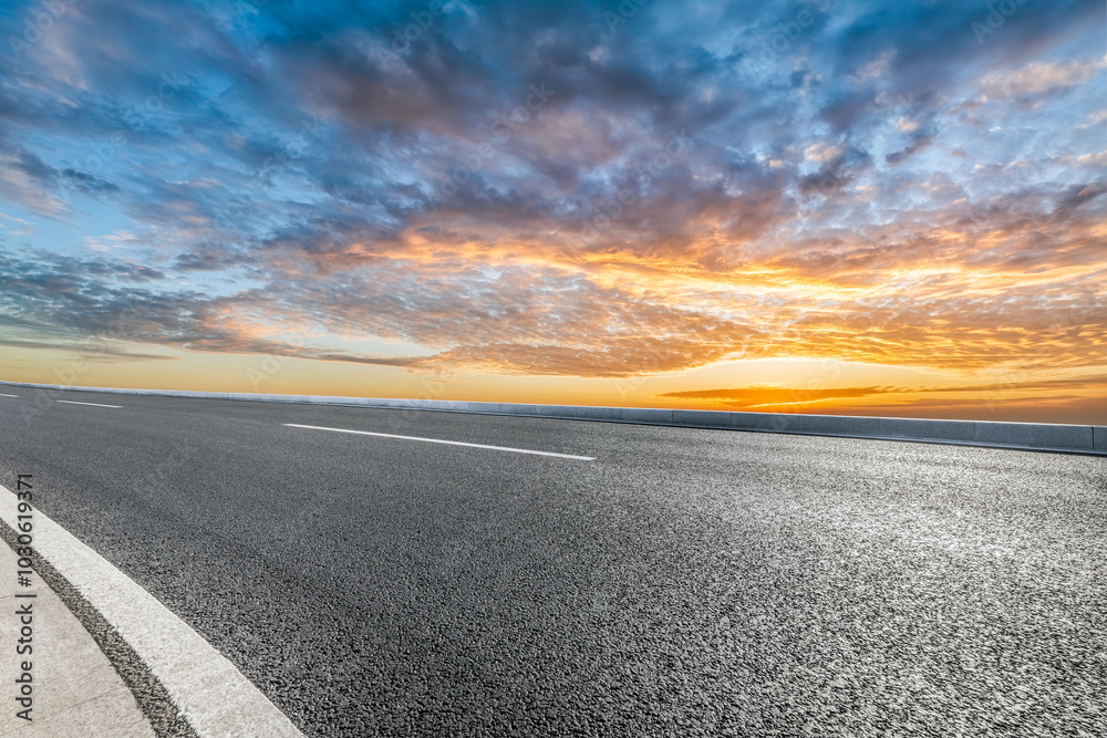 Empty asphalt road and sky cloudscape at sunset Empty asphalt road and sky cloudscape at sunset