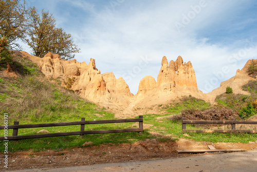 A photo capturing the fascinating natural phenomenon of sand pyramids and the blue sky. photo