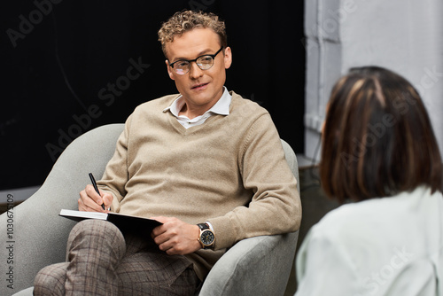 A journalist engages a specialist in a professional interview, capturing expert insights in a modern atmosphere. photo