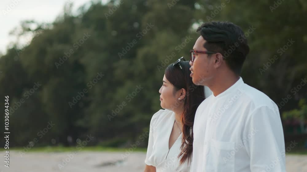 Romantic beach scene of Asian bride and groom during their wedding, captured at sunset on beautiful beach. This moment reflects love, celebration, and the beauty of marriage in a serene outdoor. Romantic beach scene of Asian bride and groom during their wedding, captured at sunset on beautiful beach. This moment reflects love, celebration, and the beauty of marriage in a serene outdoor.