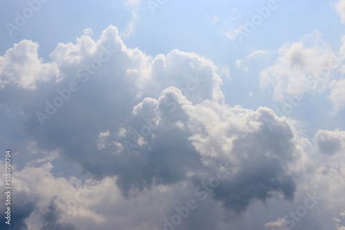 Εκτύπωση καμβά The big puffy white clouds in the blue sky.
