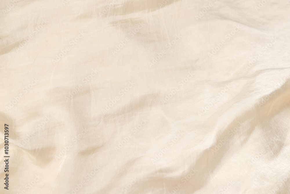 Soft smooth beige silk fabric background. Fabric texture. Soft smooth beige silk fabric background. Fabric texture.