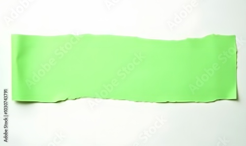 Isolated green paper strips with rips appear on a clean white surface.