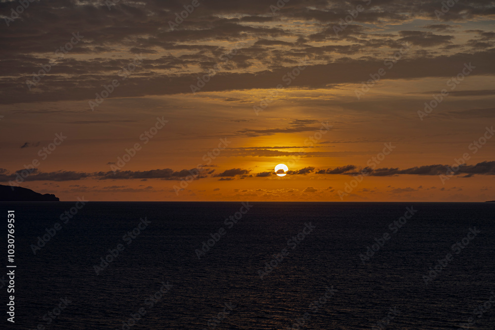 Naklejka premium sunset in black sand beach in Fogo Island, Volcano beach, Cabo Verde