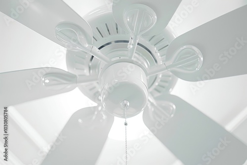 A white ceiling fan with six flat blades spinning above photo