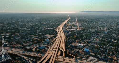 Busy traffic on the highways of Los Angeles, California, USA. Aerial perspective on vast panorama at daytime.