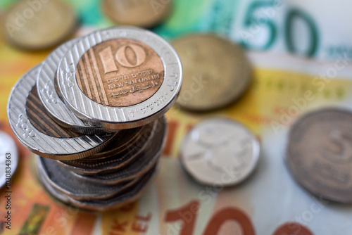 Israeli Shekels, metal coins left on the table photo