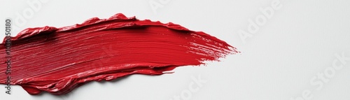 Red paint stroke on a white background, perfect for artistic designs.