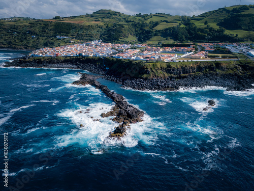 Photos The village of Maia on the Azorean coast viewed from above, featuring vibrant greenery and blue ocean waters along the rugged cliffs of Ribeira Grande