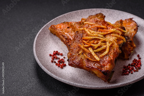 Pork or beef ribs with salt, spices and herbs baked on the grill