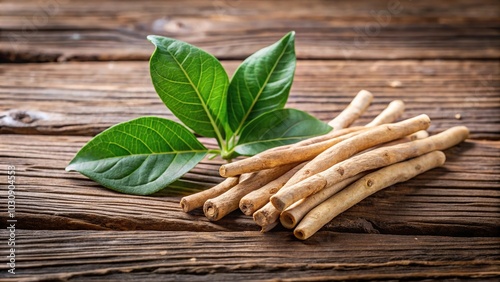 Close-up of ashwagandha root and leaves on wooden surface