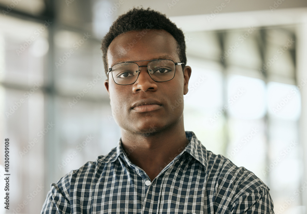 Portrait, serious and black man in office, glasses and ambitious for business, proud and expert of project. Entrepreneur, confident and person in company, professional and consultant in Nigeria Portrait, serious and black man in office, glasses and ambitious for business, proud and expert of project. Entrepreneur, confident and person in company, professional and consultant in Nigeria