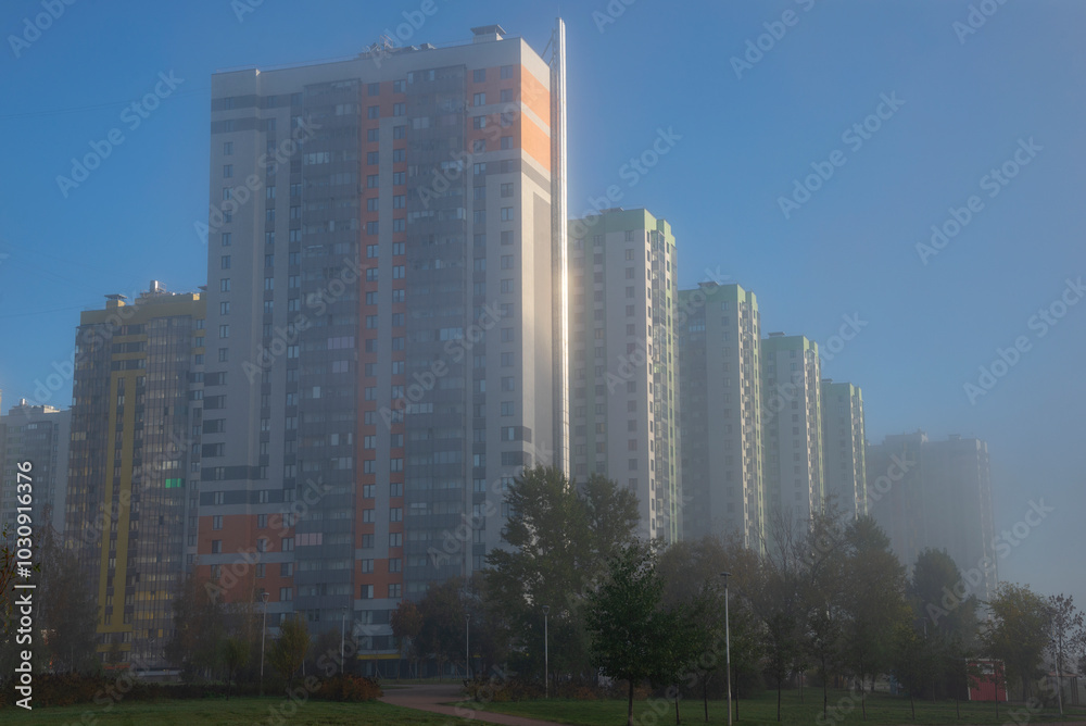 Obraz premium Modern high-rise buildings in the morning autumn fog. Saint Petersburg, Russia