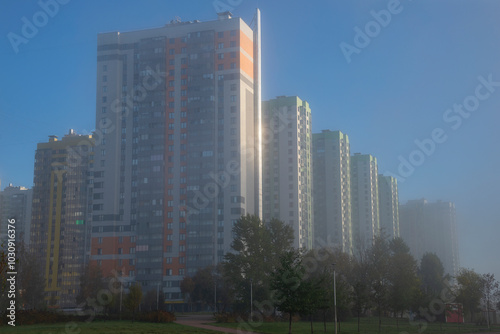 Modern high-rise buildings in the morning autumn fog. Saint Petersburg, Russia photo