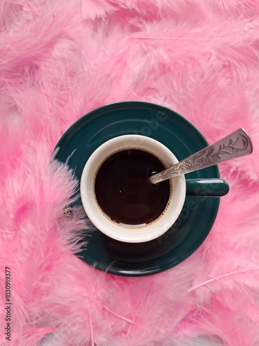 Cup of coffee on feathers