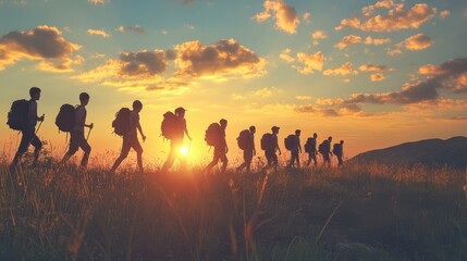 Young hikers silhouettes school group field trip camp at sunrise