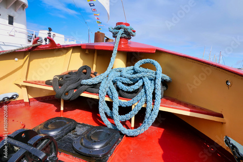 Tugboat mooring ropes situated at the prow end of the ship
