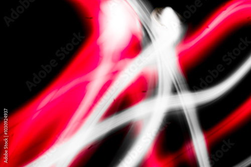 abstract image of dynamic movement of red and white color stripes on a dark background photo