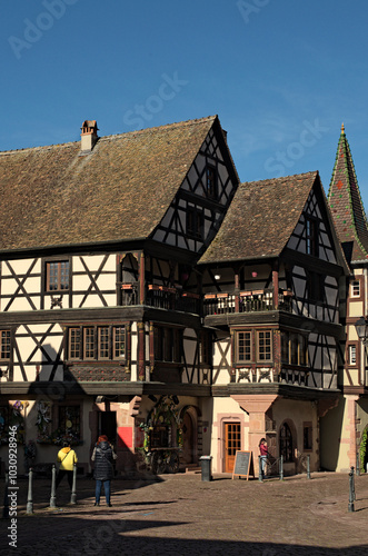 Riquewihr, France-April 11,2024:Scenic cobblestone street between old residential houses. Traditional street in medieval village Riquewihr. It is located on the Route des Vins (The Wines Road)