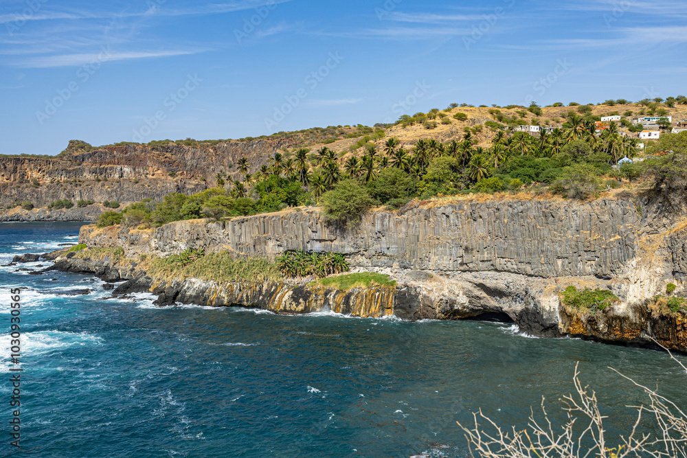 Obraz premium waterfall on the rocks, Ribeira da Barca, Pilon of Achada Leite, Aguas Belas Lagoon, Santiago Island, Cape Verde big rock in the sea