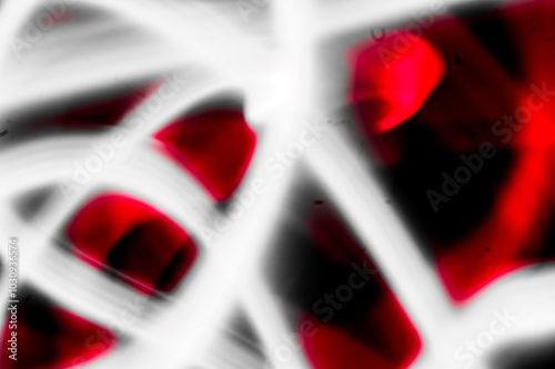 abstract image of dynamic movement of red and white color stripes on a dark background photo