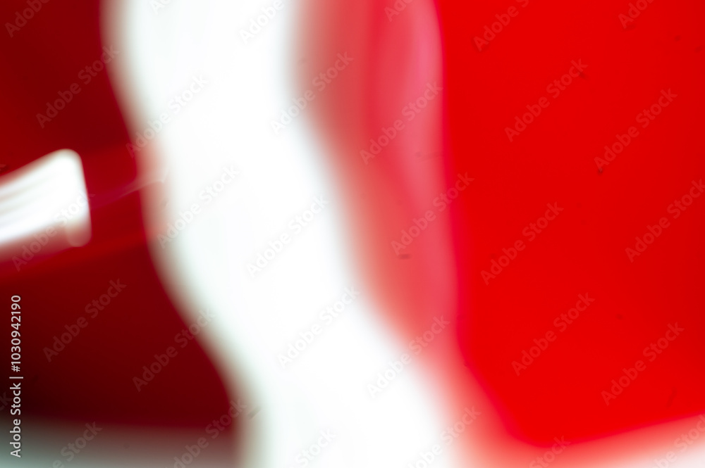 abstract image of dynamic movement of red and white color stripes on a dark background abstract image of dynamic movement of red and white color stripes on a dark background