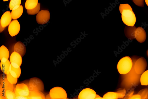 Bright yellow, gold lights, bokeh on black background