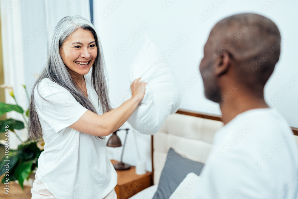 Cinematic image of an happy multiethnic senior couple. Cinematic image of an happy multiethnic senior couple.