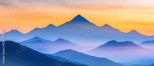 A beautiful mountain landscape at sunset, showcasing layers of peaks enveloped in mist and vibrant colors.