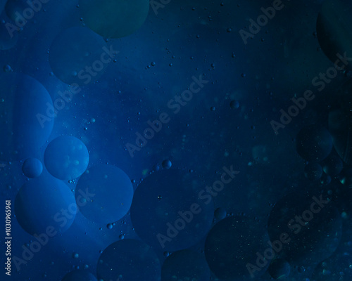 Abstract blue background of bubbles on water similar to the starry sky