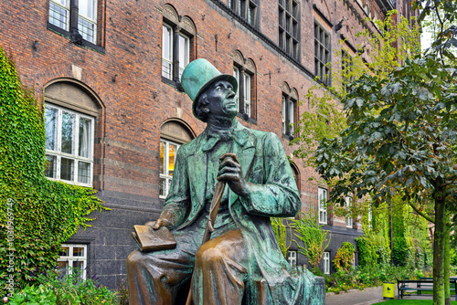 The statue of renowned Danish author Hans Christian Andersen sits outside Copenhagen City Hall, Denmark, symbolizing his legacy and contributions to literature and fairy tales.