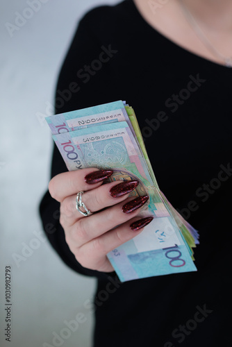 Female hands holding paper bills Belarusian rubles photo