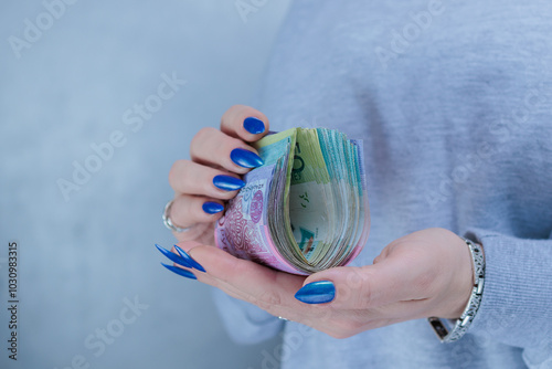 Female hands holding paper bills Belarusian rubles photo