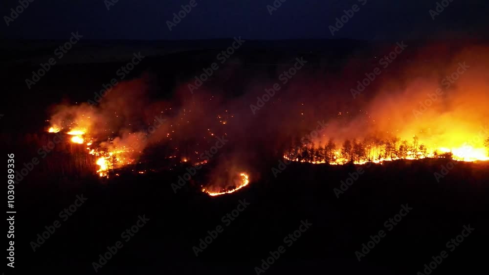 Aerial view of wildfires burning fields and woods on summer night. Infernal fires scorching earth and forest during seasonal drought. Wild fire destroying crops and plantations.
Aerial view of wildfires burning fields and woods on summer night. Infernal fires scorching earth and forest during seasonal drought. Wild fire destroying crops and plantations.
