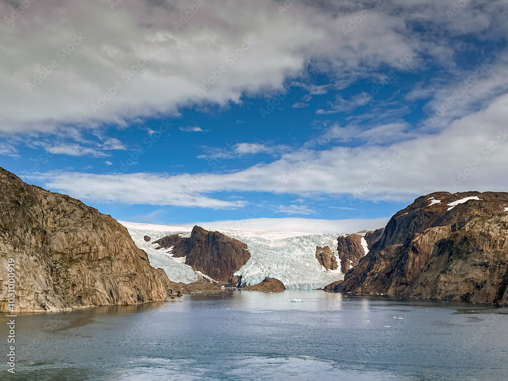 Glacier flowing to the water's edge of one of the fjords inPrince Christian Sound in Greenland Glacier flowing to the water's edge of one of the fjords inPrince Christian Sound in Greenland