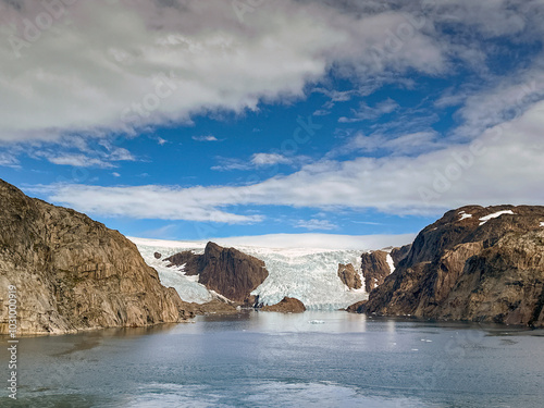 Glacier flowing to the water's edge of one of the fjords inPrince Christian Sound in Greenland