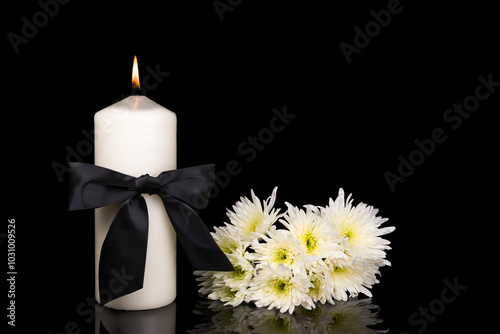 photo of beautiful flowers  and candles on black background