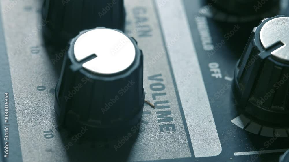Man adjusting volume knob on guitar amplifier. 4k video footage UHD 3840x2160