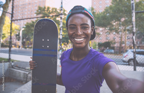 Young girl performing tricks with the skateboard in a skate park