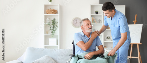 Quadro em tela Male nurse with senior man in wheelchair at home
