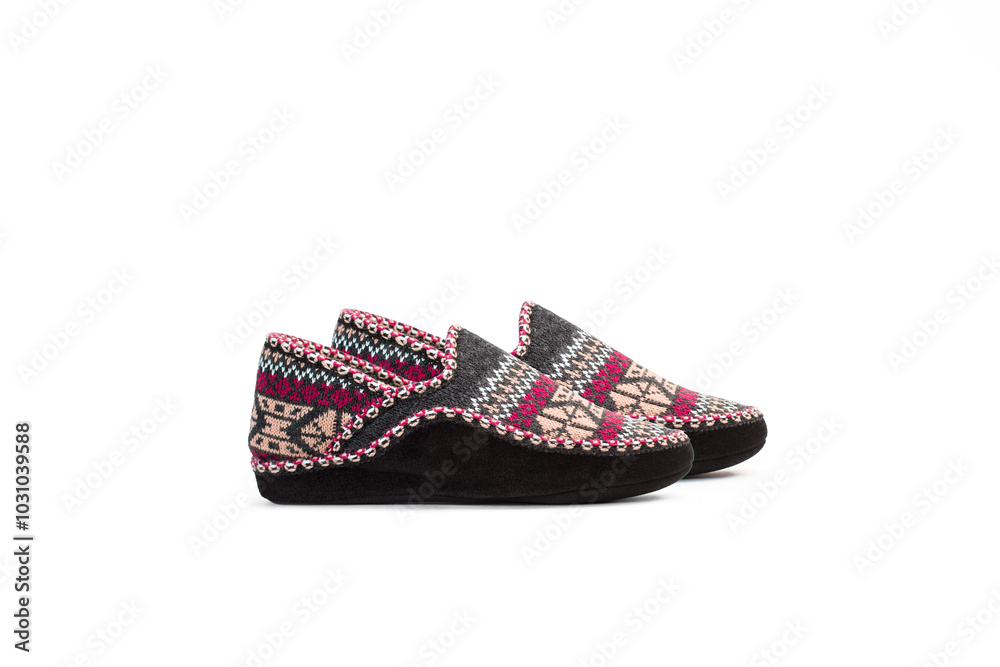 A pair of fluffy winter slippers on a white background with copy space