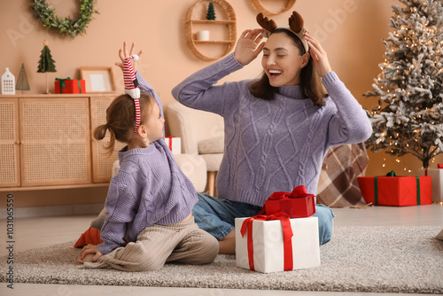 Happy mother and her little...