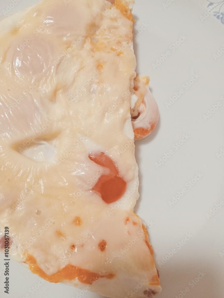 closeup of cooked egg with egg white and yolk