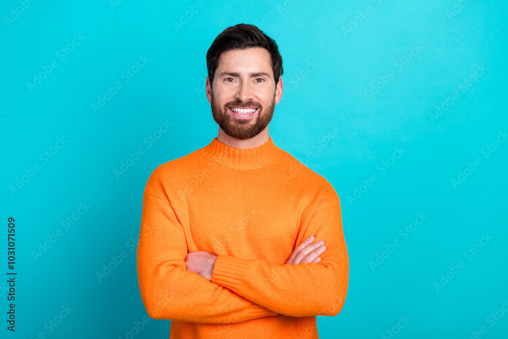 Photo of cheerful attractive man folded arms wear trendy clothes isolated on aquamarine color background Photo of cheerful attractive man folded arms wear trendy clothes isolated on aquamarine color background