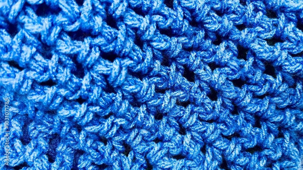 close up texture of blue color crocheted. woolen threads. top view close up texture of blue color crocheted. woolen threads. top view