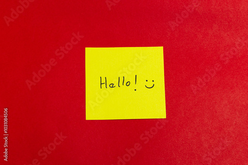 A yellow sticky note with the word 