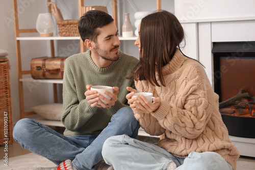 Loving couple with cups of ...