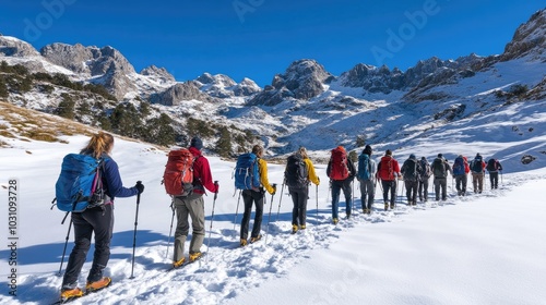 Group Trekking Through Snowy Mountain Landscape