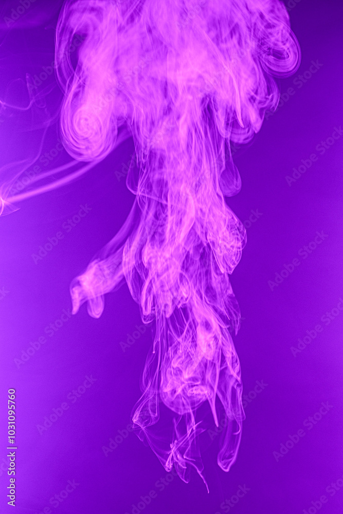 Twisted plume of smoke. The movement of smoke on a colored background. Abstract smoke lines Twisted plume of smoke. The movement of smoke on a colored background. Abstract smoke lines