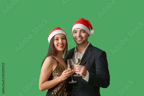 Young couple in Santa hats ...